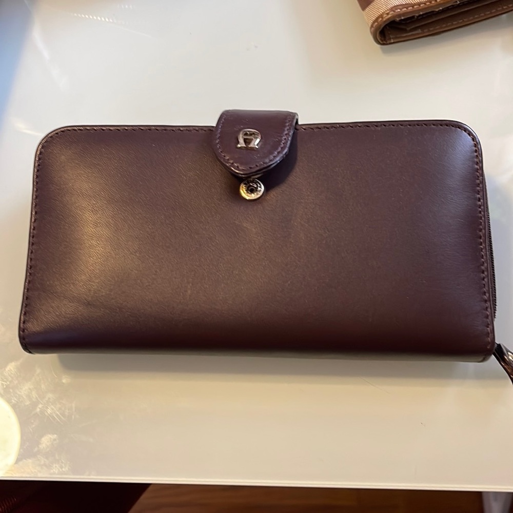 Old Aigner wallet. Brown. Never used but not properly stored. Came from smoker.